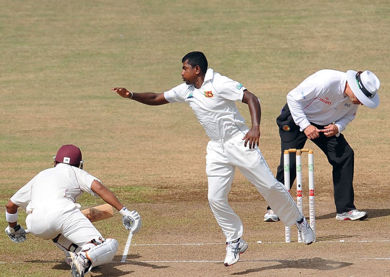 Rangana Herath tries to stop a shot from Carlton Baugh, Sri Lanka v West Indies, 2nd Test, Premadasa Stadium, Colombo, 5th day, November 27, 2010