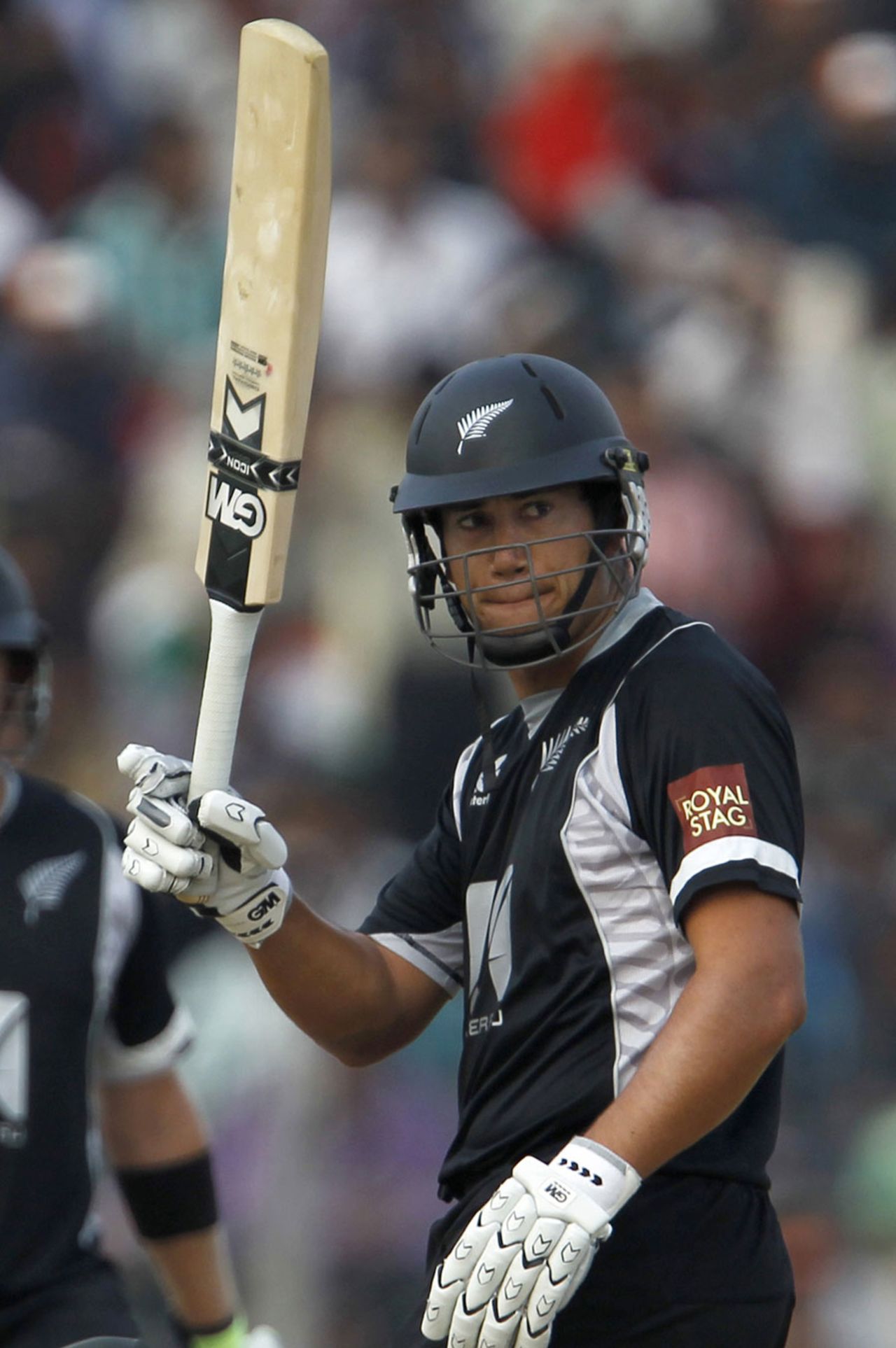Ross Taylor raises his bat on getting to his half-century, India v New Zealand, 1st ODI, Guwahati, November 28, 2010
