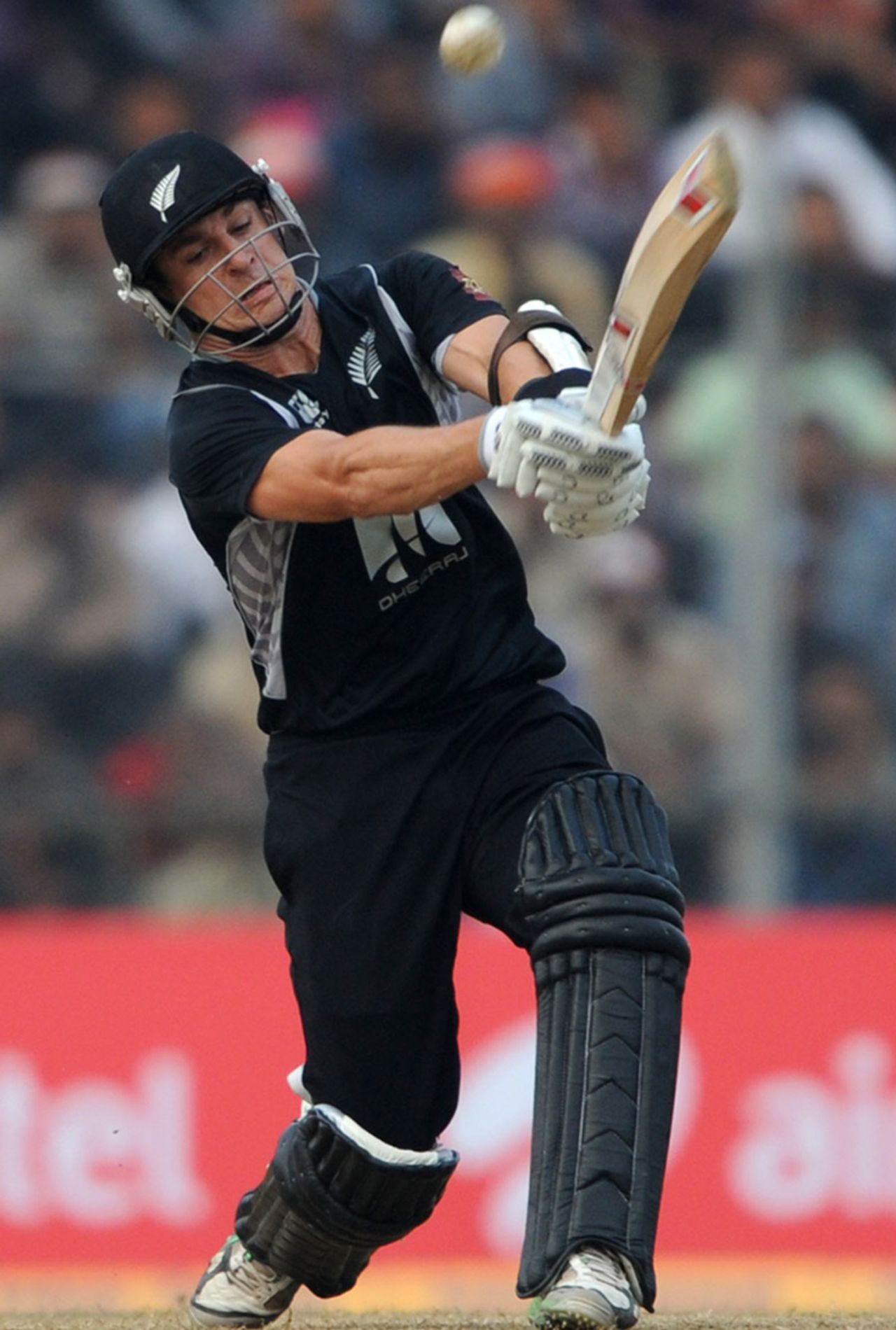 Nathan McCullum heaves the ball to the leg side during his run-a-ball 35, India v New Zealand, 1st ODI, Guwahati, November 28, 2010