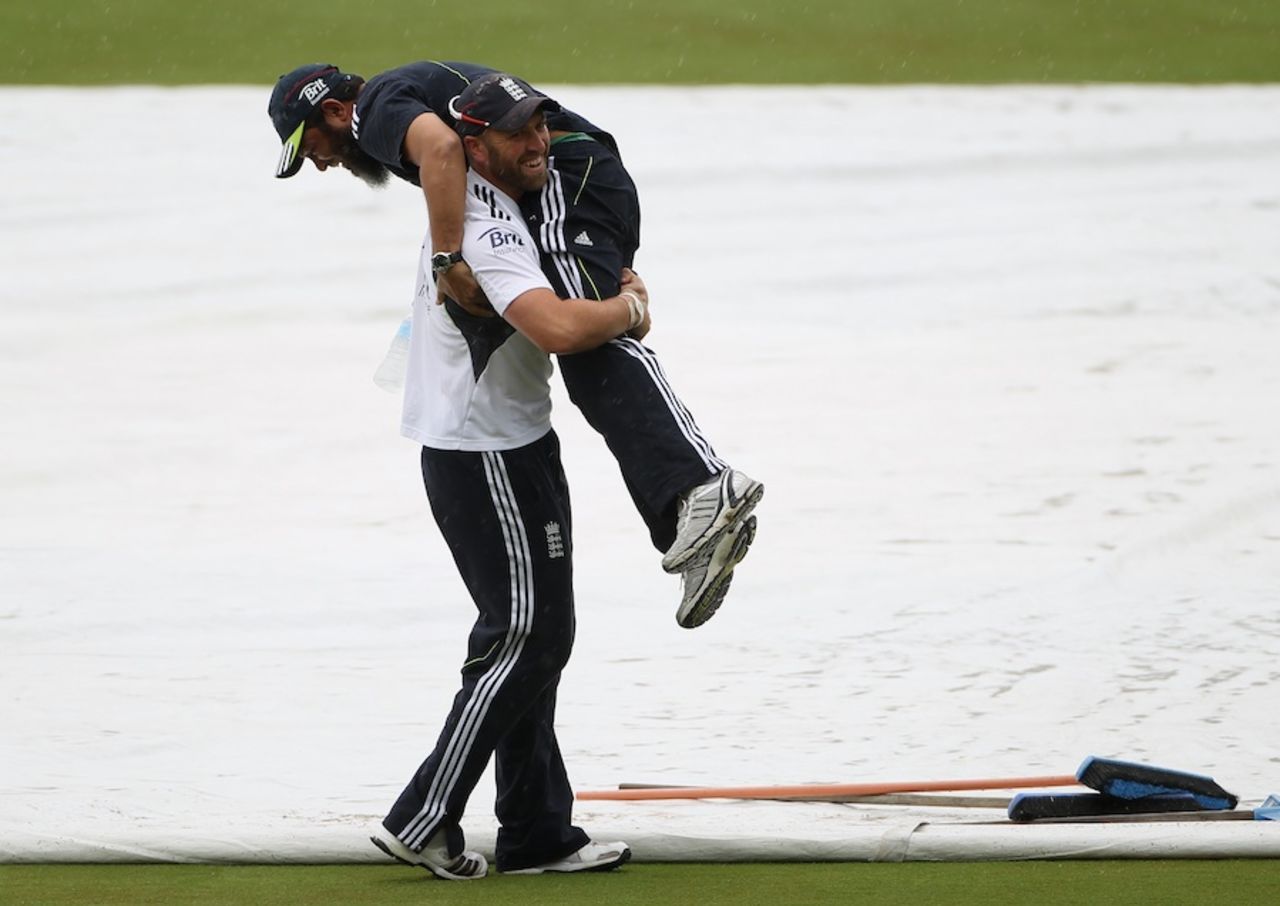Matt Prior has a bit of fun with Mushtaq Ahmed on a drizzly day in Adelaide, December 1, 2010