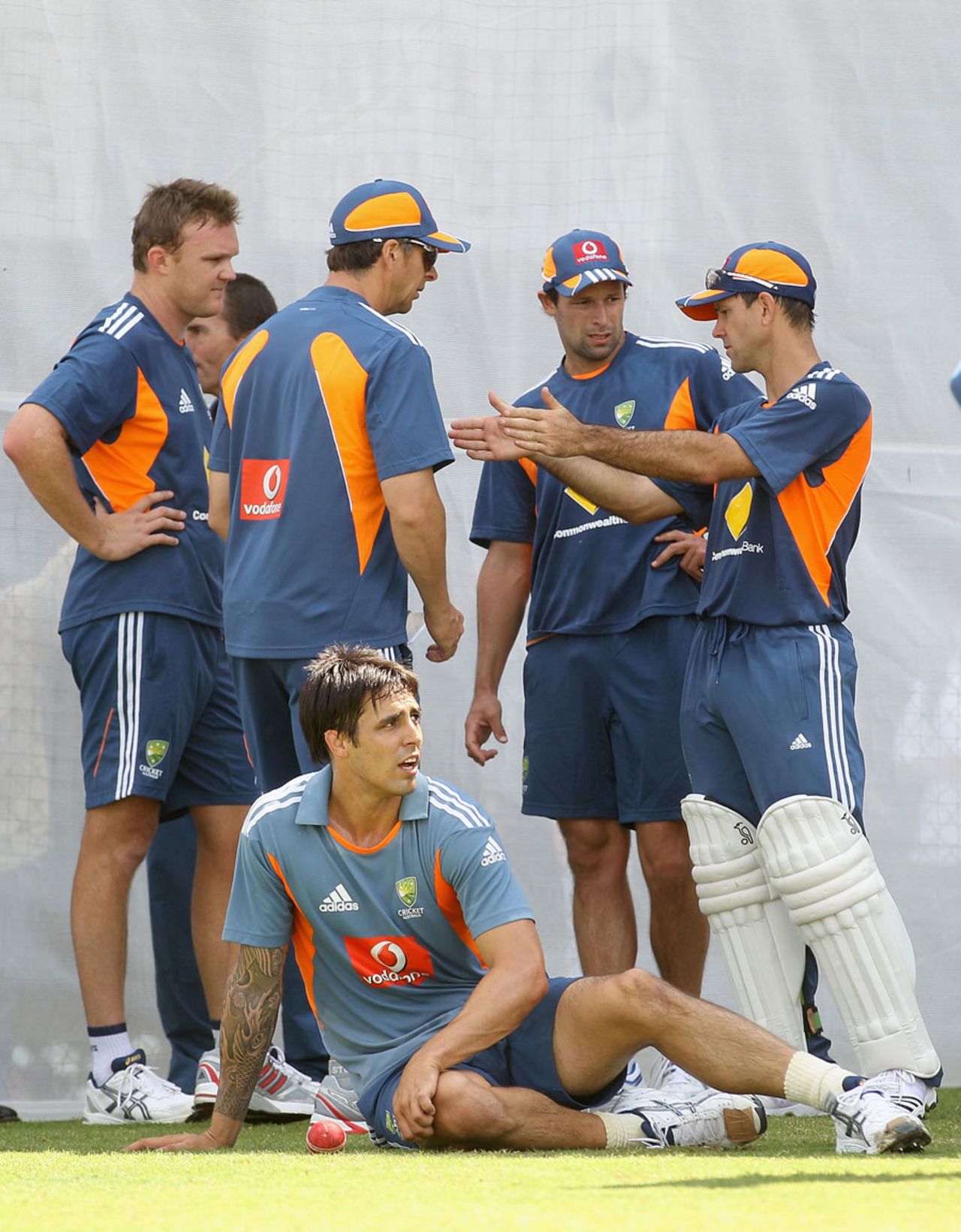 Mitchell Johnson takes a break while Ricky Ponting issues instructions at a net session, Adelaide, December 2, 2010