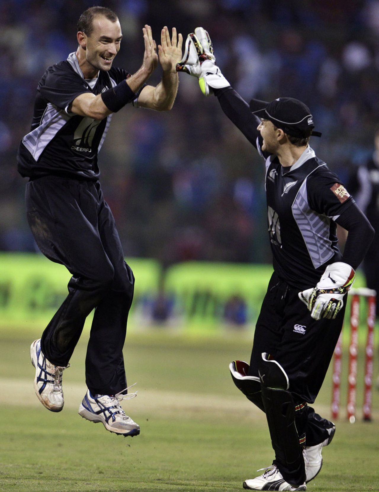 Andy McKay and Brendon McCullum celebrate the wicket of Virat Kohli, India v New Zealand, 4th ODI, Bangalore, December 7, 2010