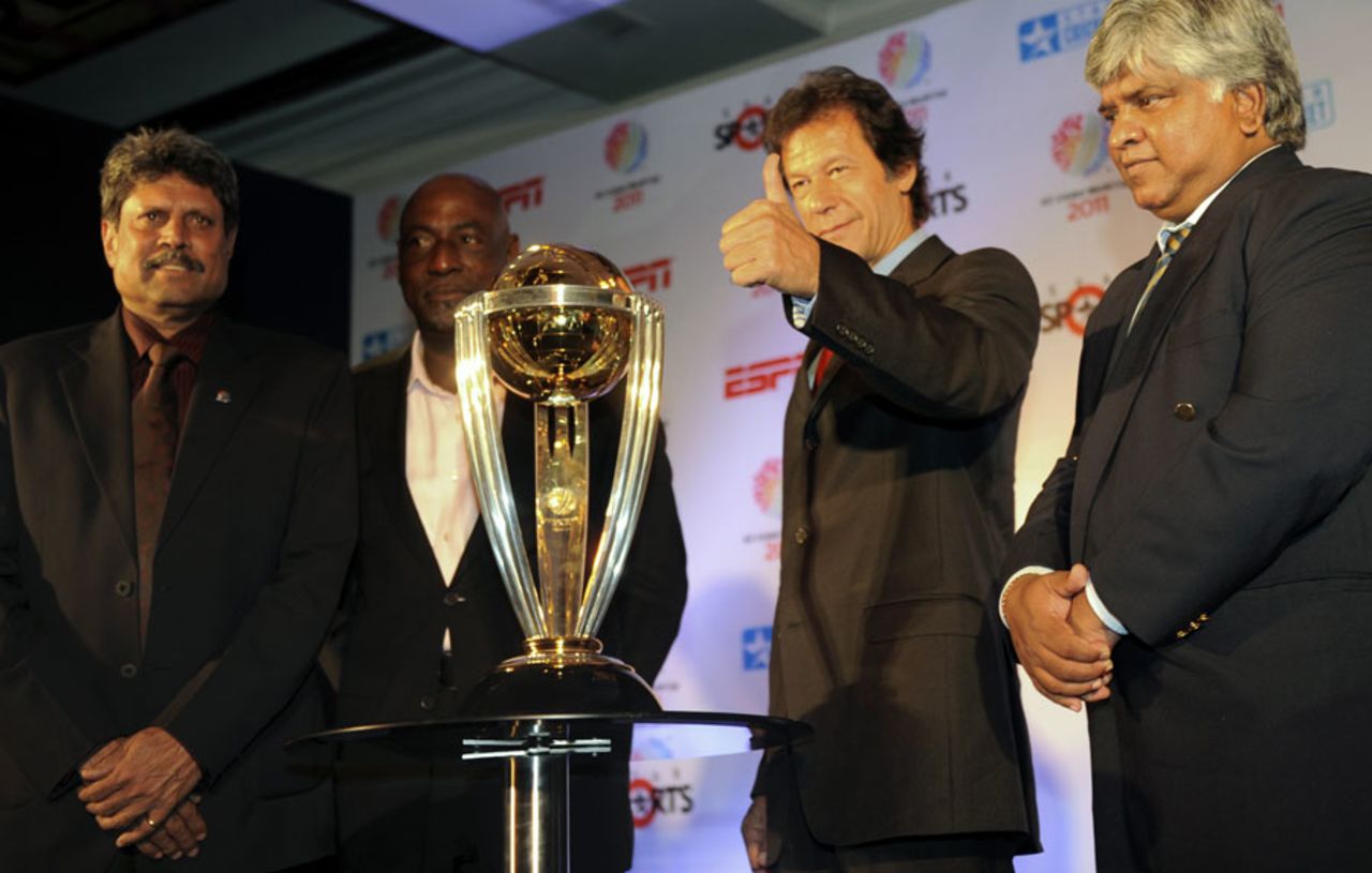 World Cup heroes Kapil Dev, Viv Richards, Imran Khan and Arjuna Ranatunga pose with the 2011 trophy, New Delhi, December 9, 2010
