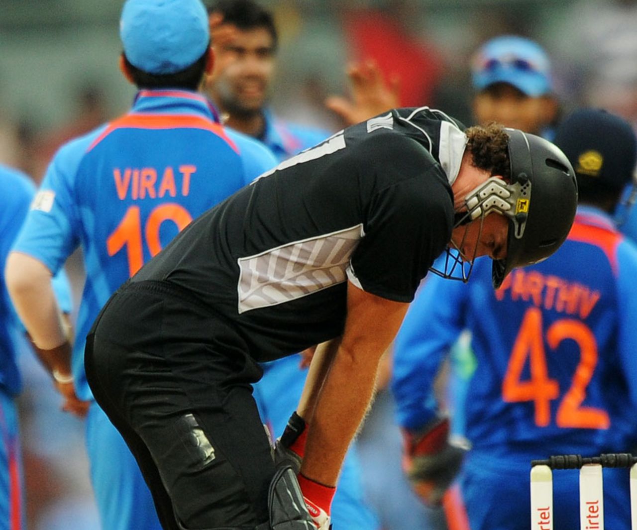 Kyle Mills bows his head in anguish after getting out , India v New Zealand, 5th ODI, Chennai, December 10, 2010