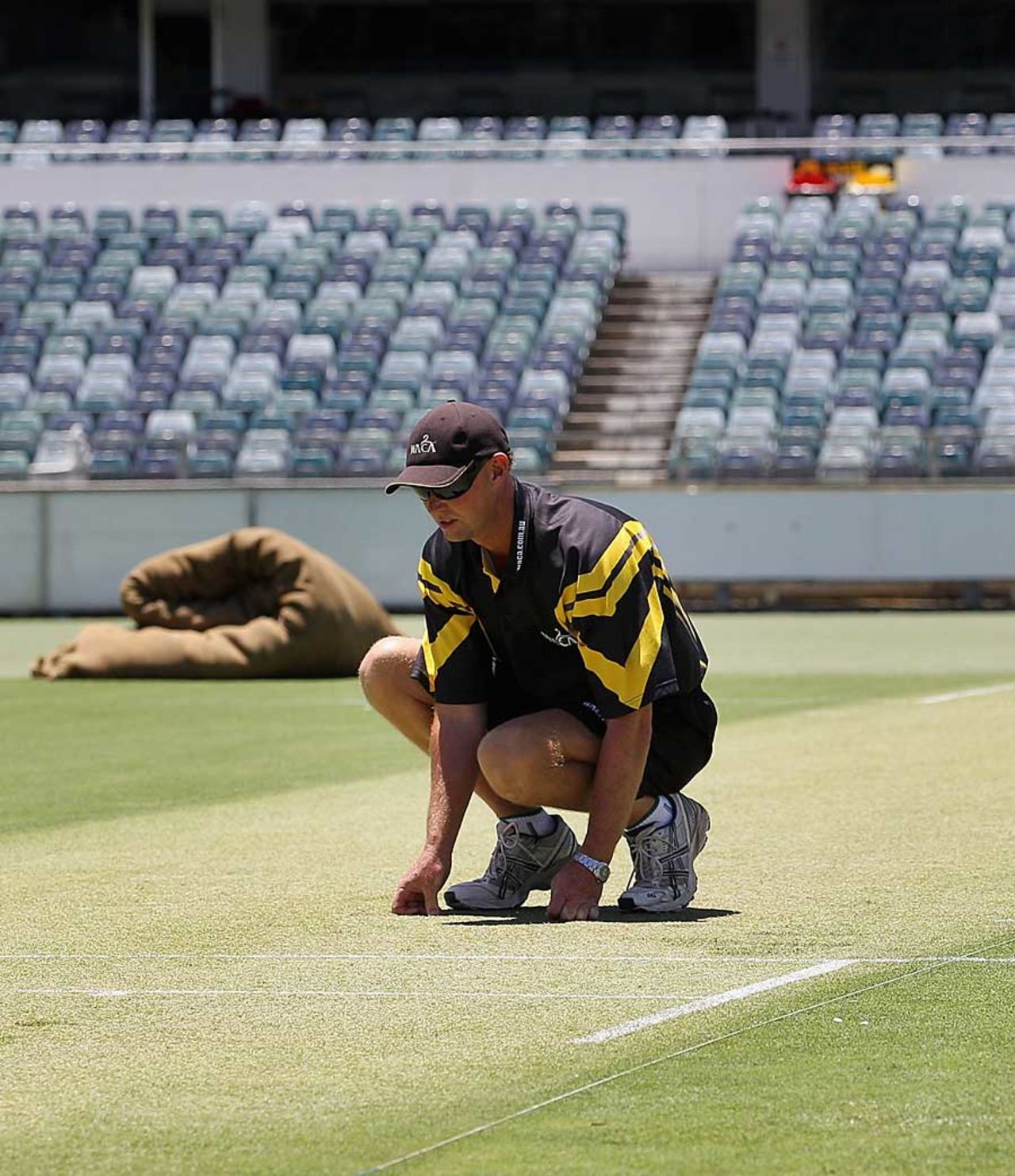 Cameron Sutherland, the WACA curator, inspects his Test pitch, Perth, December 14, 2010