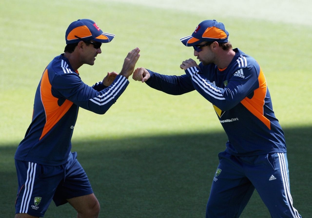 Justin Langer gets Phillip Hughes geed up during Australia's training session, Perth, December 14, 2010