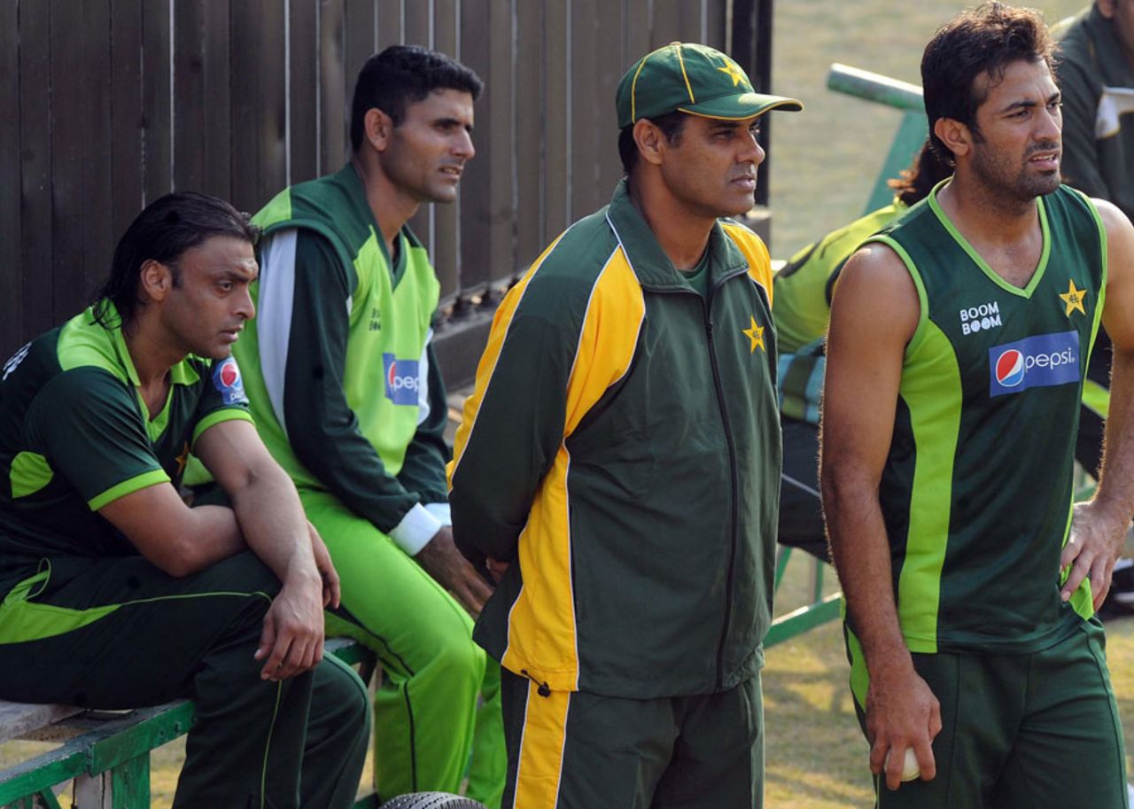Pakistan players along with coach Waqar Younis look on during practice, Lahore, December 14, 2010