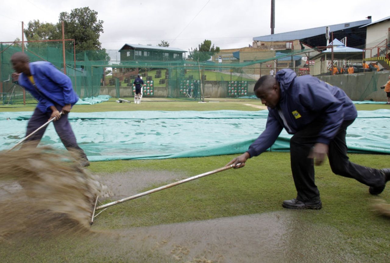 The groundstaff clear water from the field at SuperSport Park , Centurion, December 15, 2010