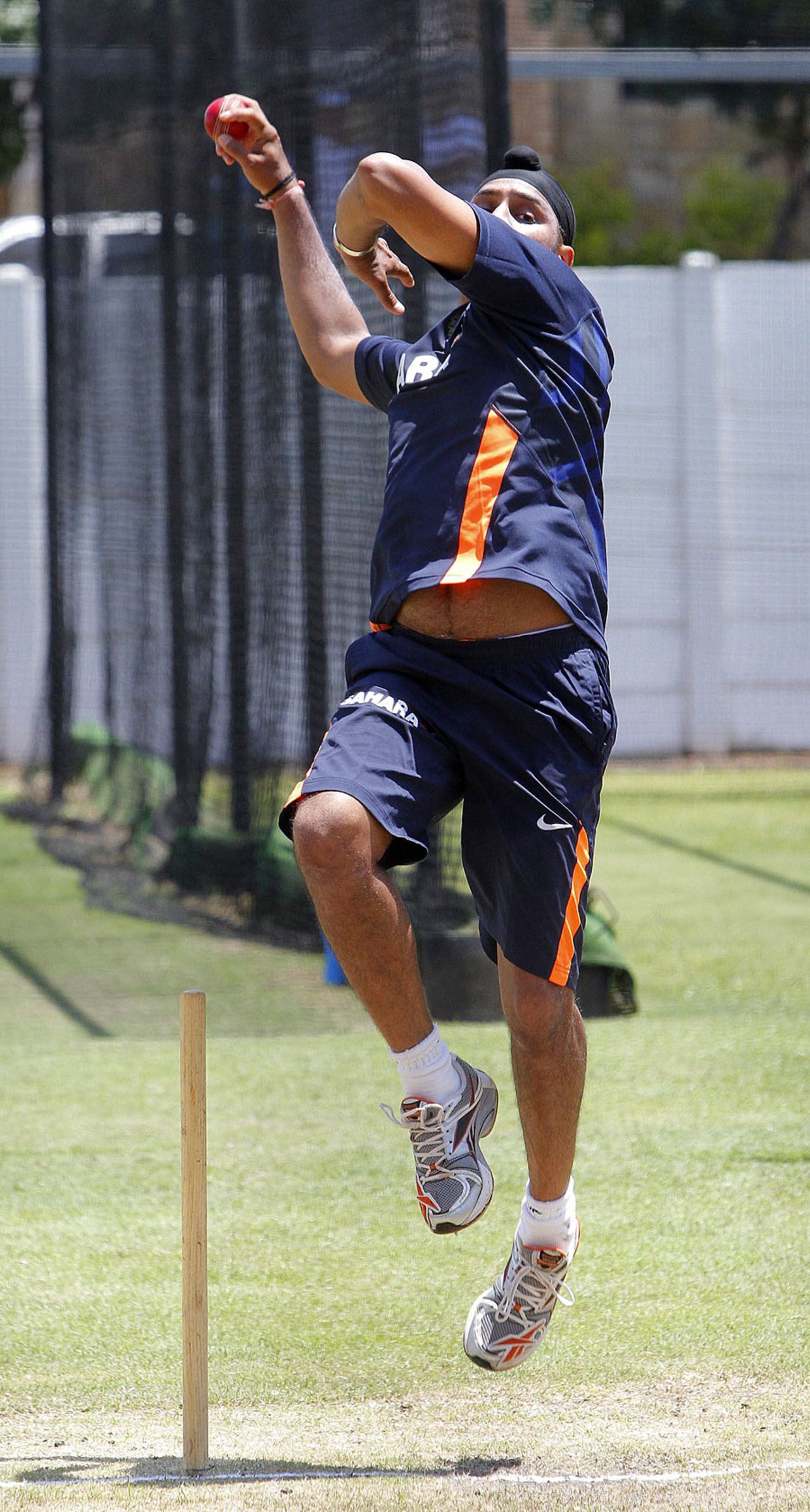 Harbhajan Singh works on his bowling during the nets session, Durban, December 24, 2010