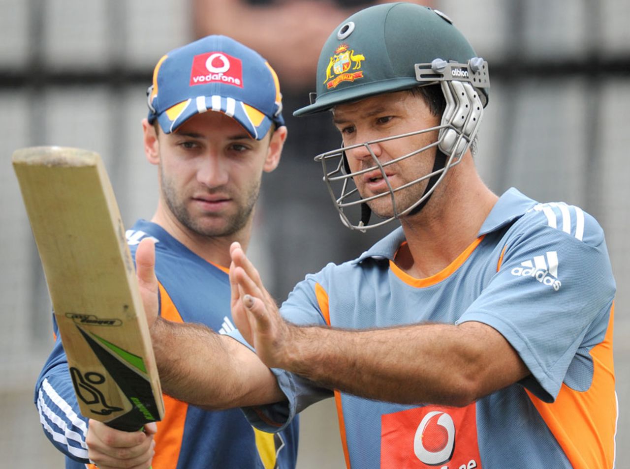 Ricky Ponting and Phil Hughes take a close look at a bat, December 25, 2010