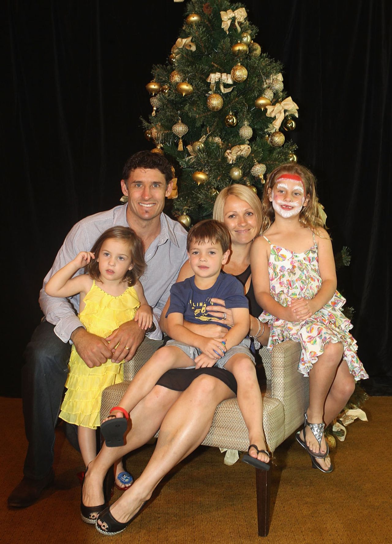 Michael Hussey with wife Amy and their children at the Australian team's Christmas celebration, Melbourne, December 25, 2010