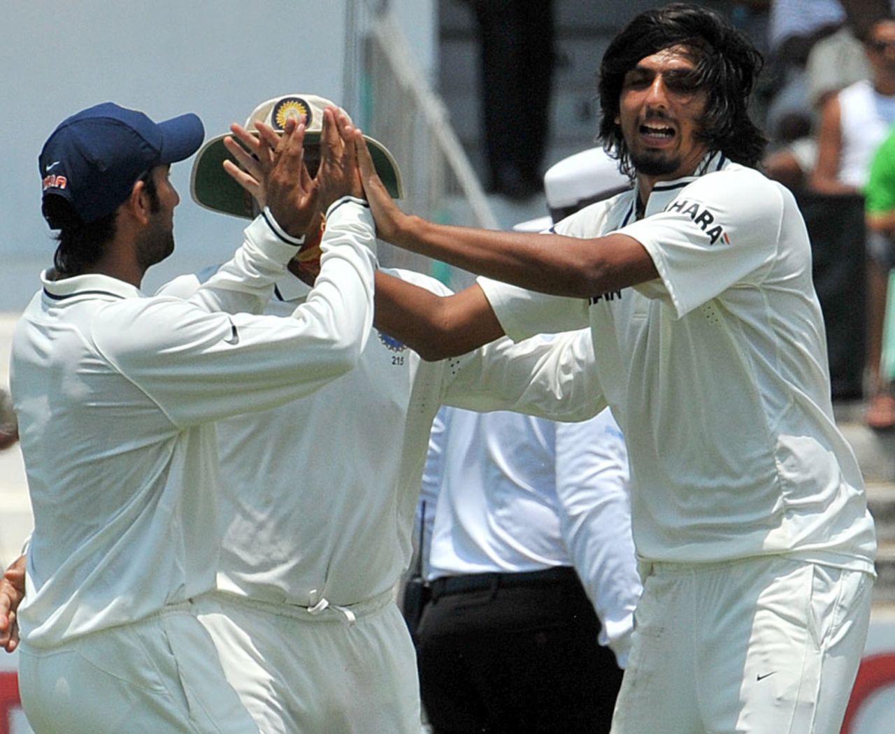 Ishant Sharma is congratulated by Cheteshwar Pujara for running out Jacques Kallis, South Africa v India, 2nd Test, Durban, 2nd day, December 27, 2010 