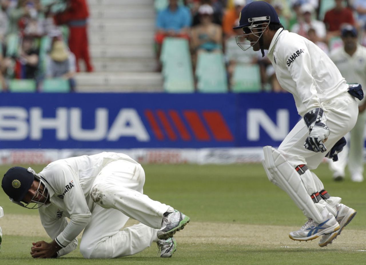 Cheteshwar Pujara dives to his right at forward short leg to catch Paul Harris, South Africa v India, 2nd Test, Durban, 2nd day, December 27, 2010 