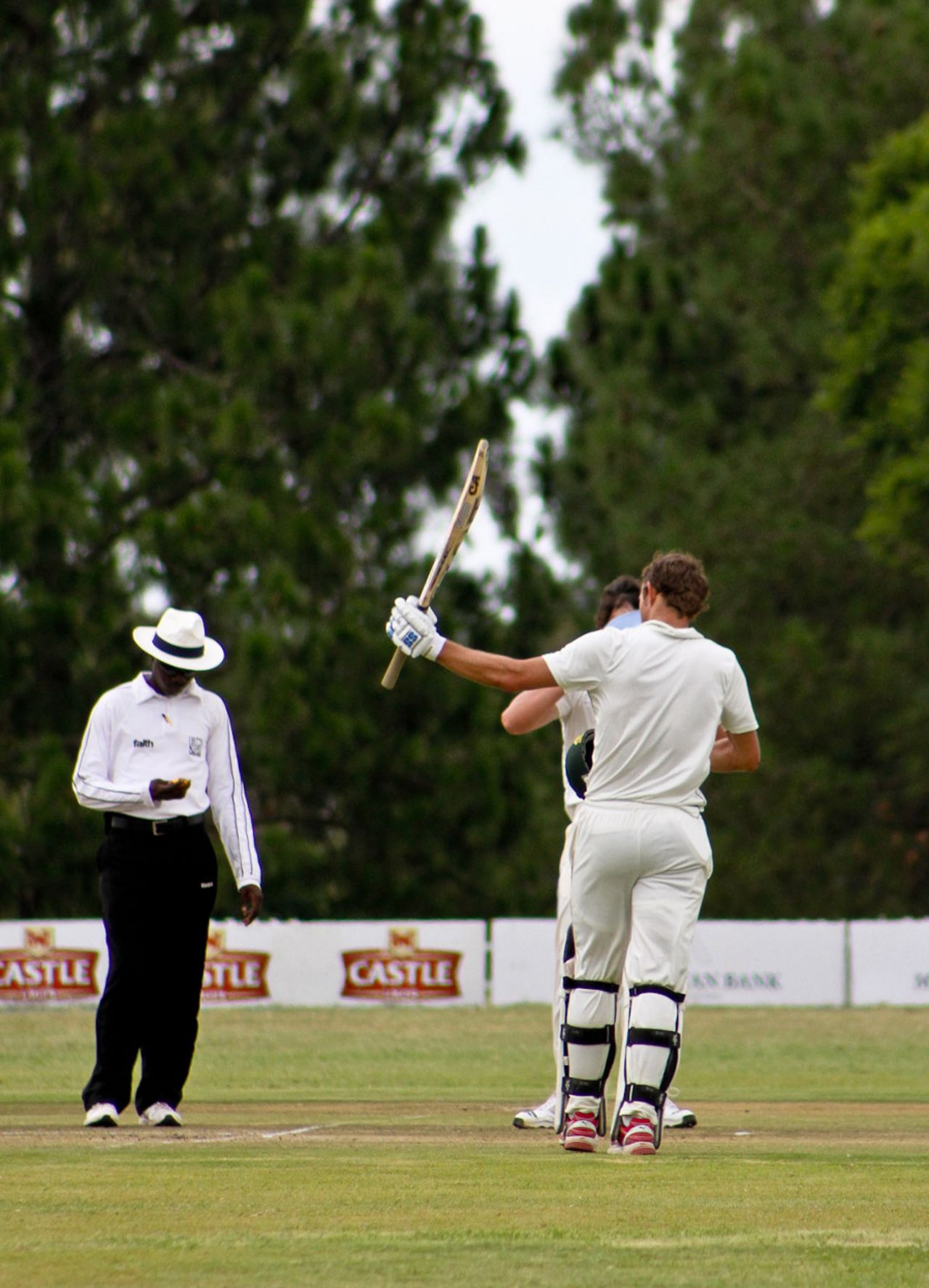 Craig Ervine raises his bat after reaching a hundred, Southern Rocks v Matabeleland Tuskers, Logan Cup, Masvingo, January 6, 2011