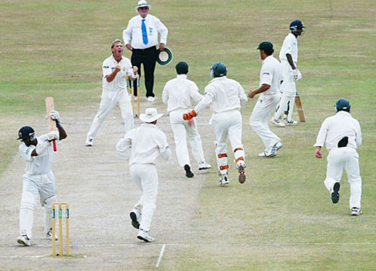 Shane Warne celebrates his 500th Test wicket as he removes Hashan Tillakaratne, Sri Lanka v Australia, 1st Test, Galle, 5th day, March 12, 2004