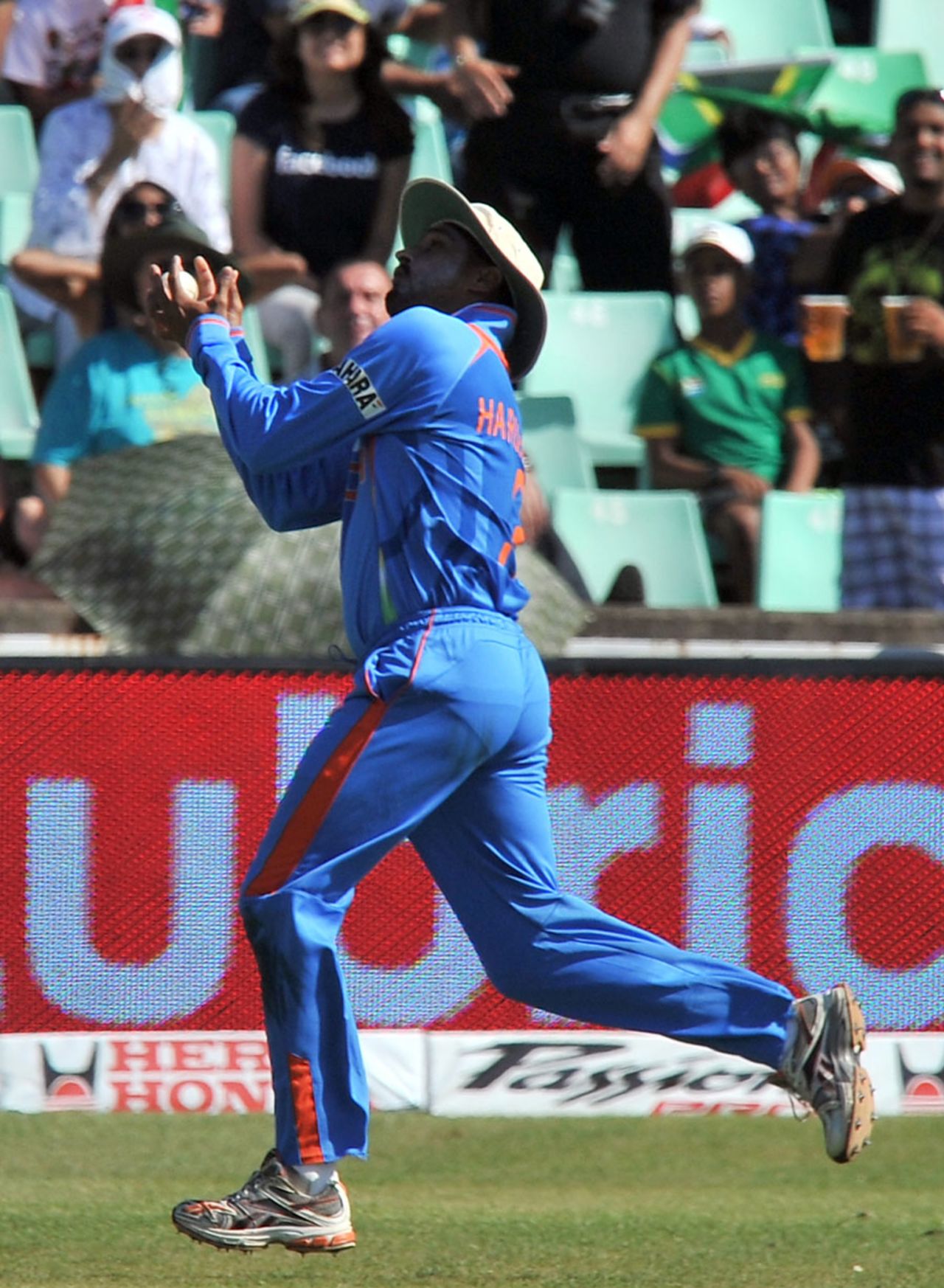 Harbhajan Singh holds on to a swirling catch to dismiss Hashim Amla, South Africa v India, 1st ODI, Durban, January 12, 2011