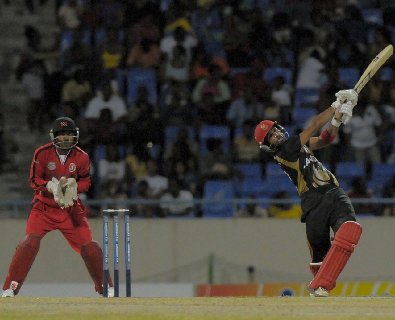 Zubin Surkari goes for a big shot during his 42, Canada v Trinidad & Tobago, Antigua, Caribbean T20, January 15, 2011 