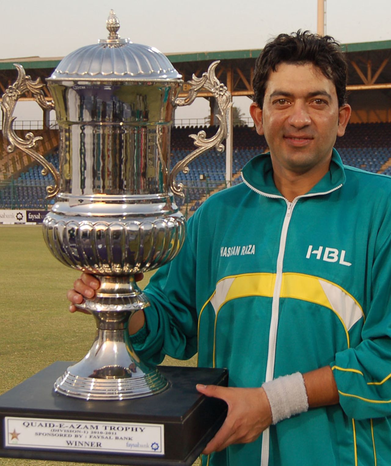 Hasan Raza, the HBL captain, poses with the winner's trophy, HBL v PIA, Quaid-e-Azam Trophy Division One Final, fifth day, Karachi, January 17, 2011