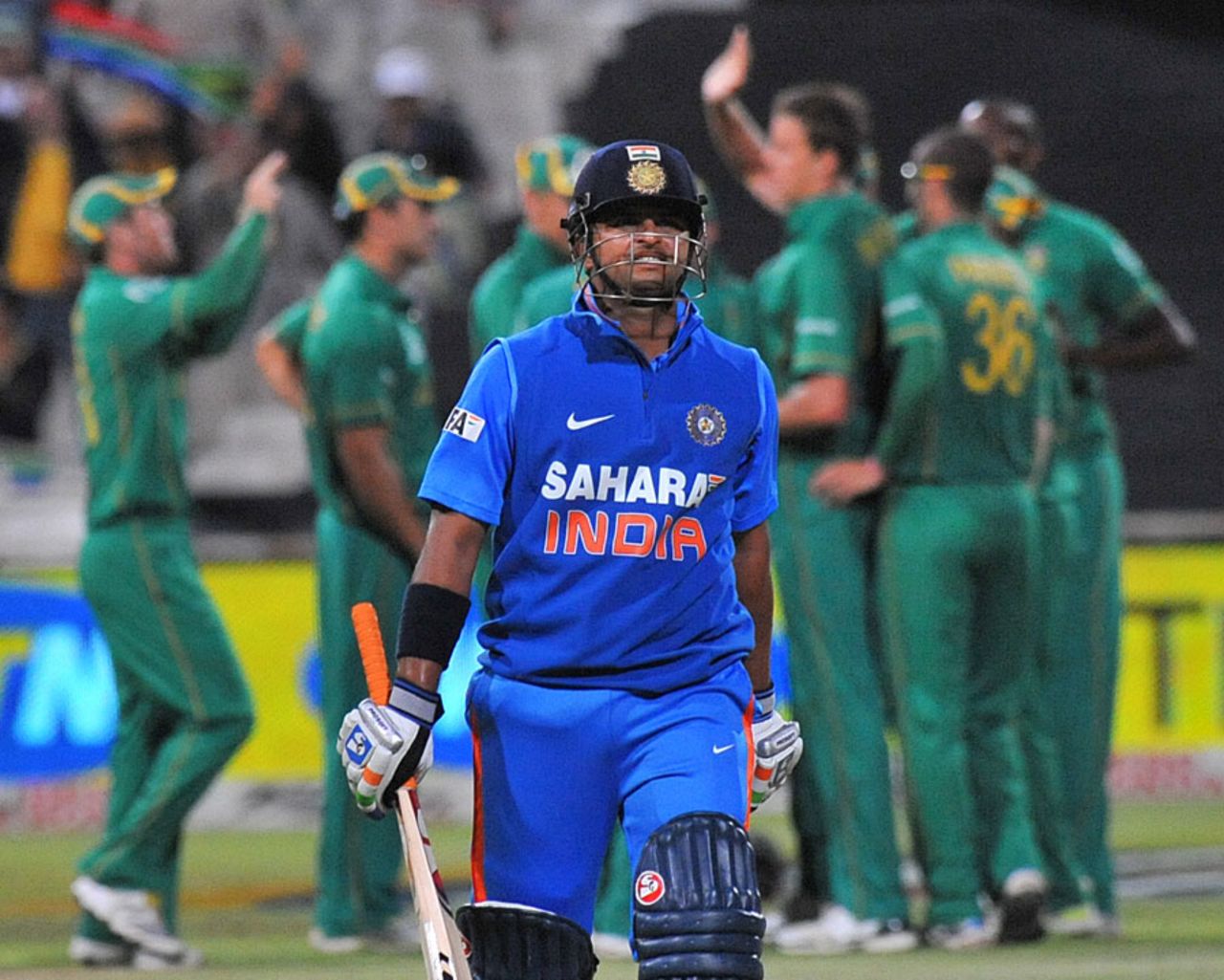 Suresh Raina walks back after making 37, South Africa v India, 3rd ODI, Cape Town, January 18, 2011