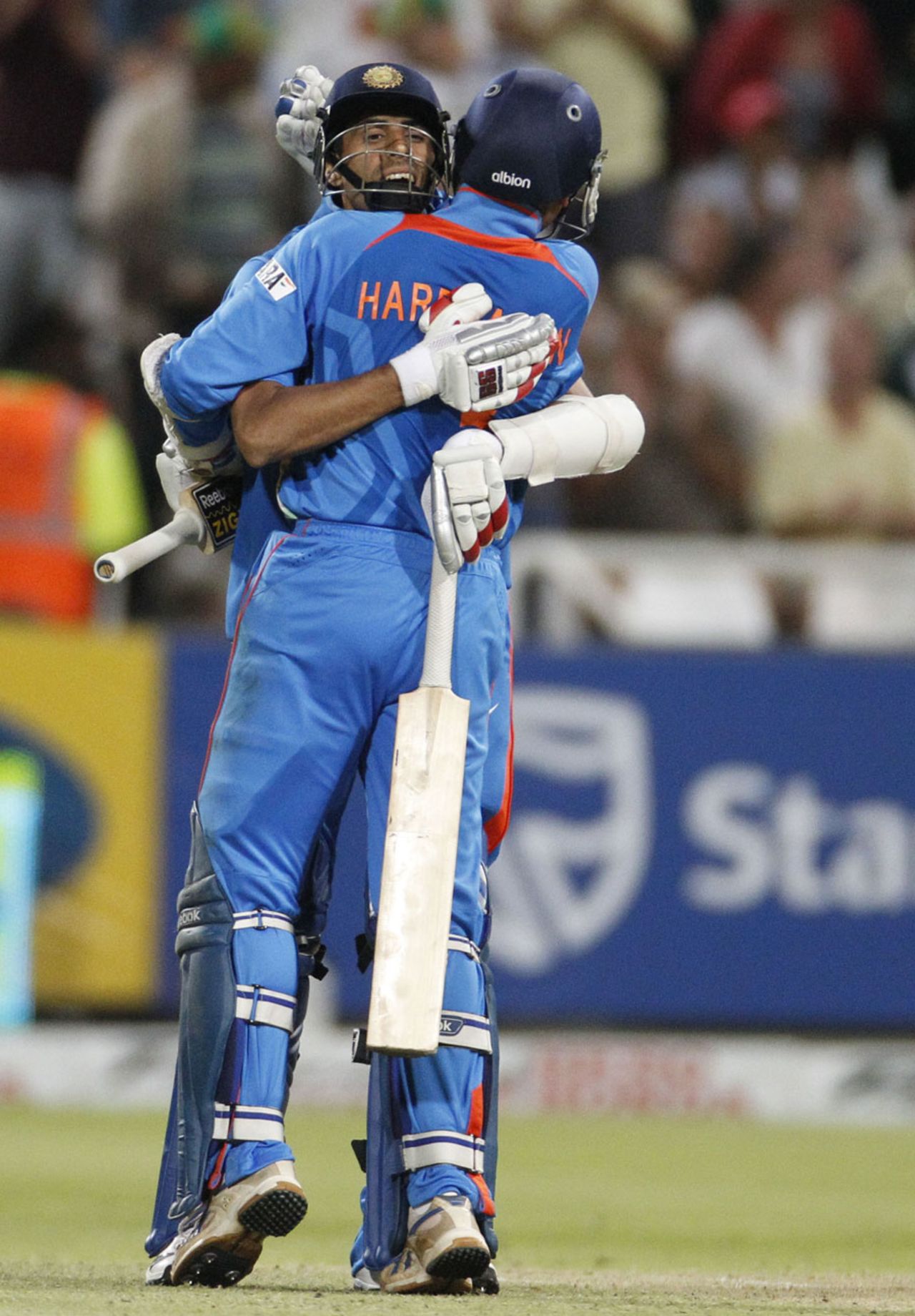 Ashish Nehra and Harbhajan Singh celebrate India's win, South Africa v India, 3rd ODI, Cape Town, January 18, 2011