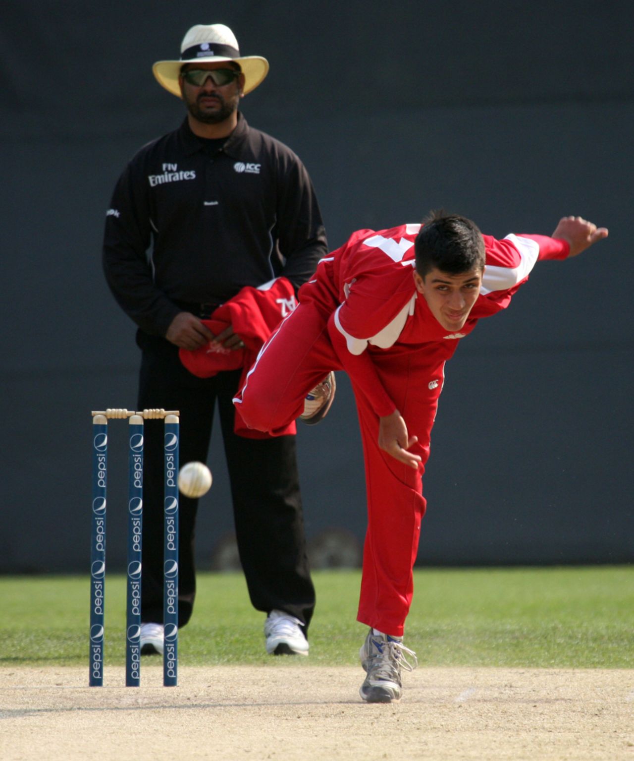 Aizaz Khan bowls for Hong Kong, Italy v Papua New Guinea, WCL Division 3, Wong Nai, January 23, 2011