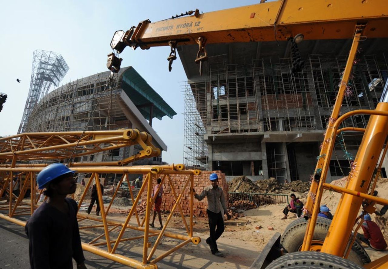A payloader removes an iron structure  during the renovation of Eden Gardens, Kolkata, January 5, 2011