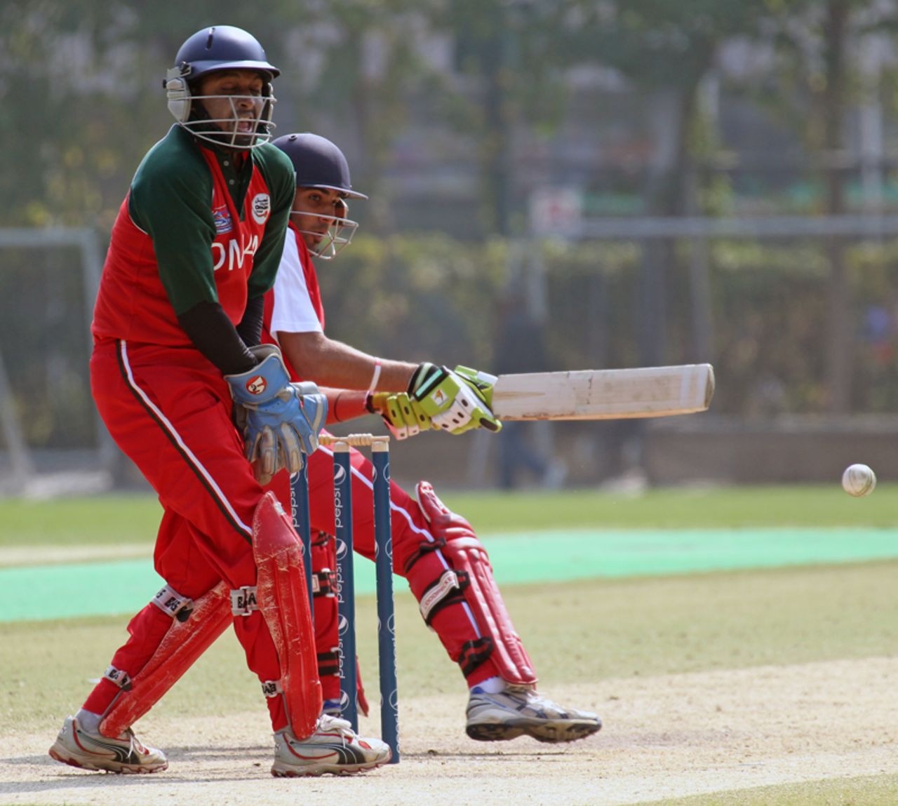 Hong Kong's Waqas Barkat reverse sweeps against Oman at Kowloon Cricket Club during the ICC WCL Division 3 match played on 23rd January 2011