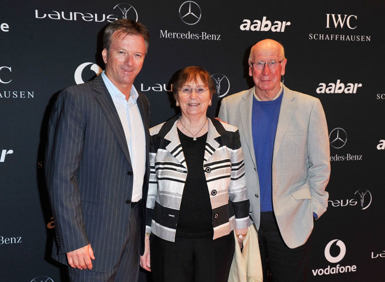 Steve Waugh poses with football legend Sir Bobby Charlton and his wife at the Laureus sports awards welcome party, Abu Dhabi, February 6, 2011