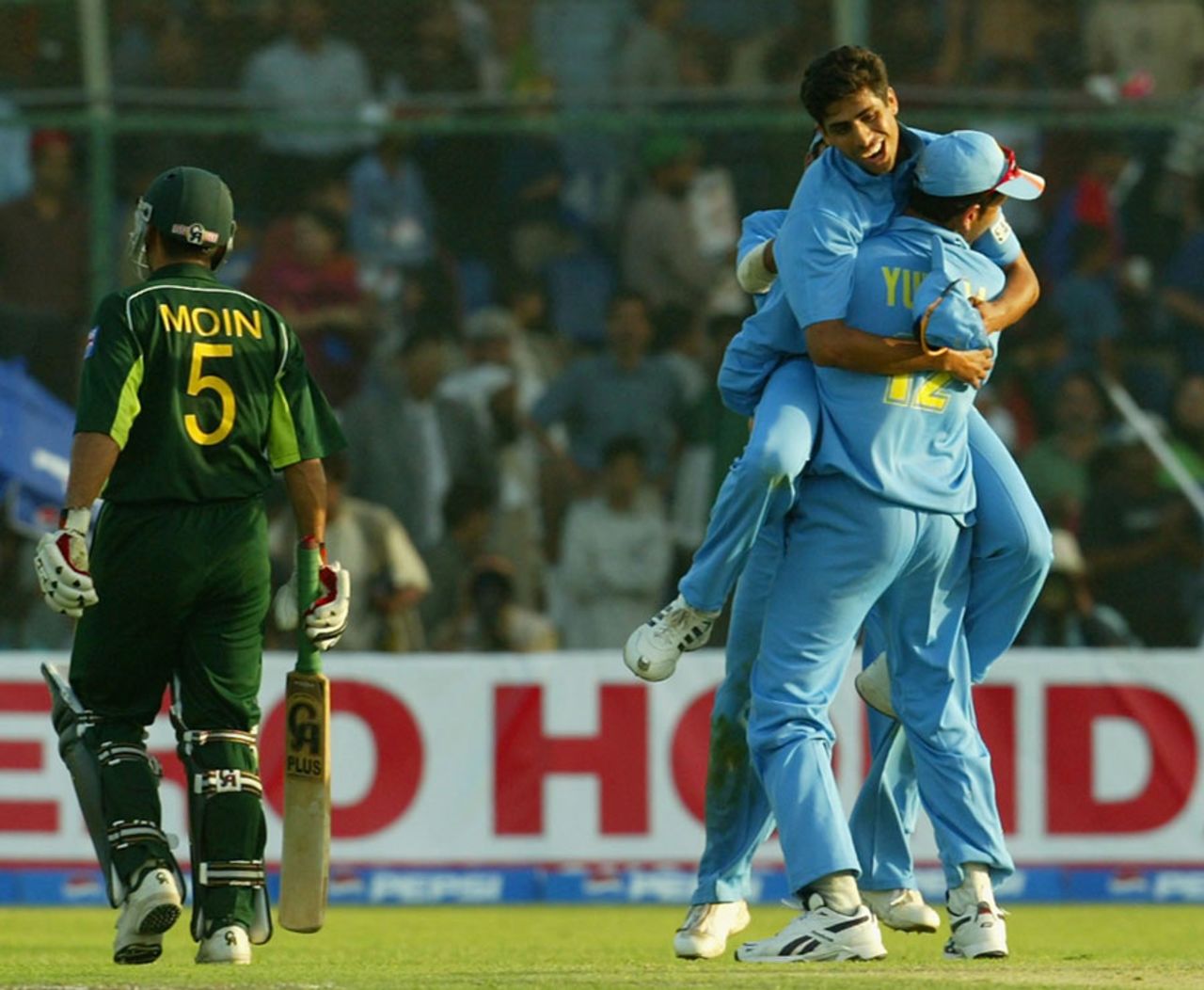 India celebrate as Moin Khan walking back after being dismissed, Pakistan v India, 1st ODI, Karachi, March 13, 2004
