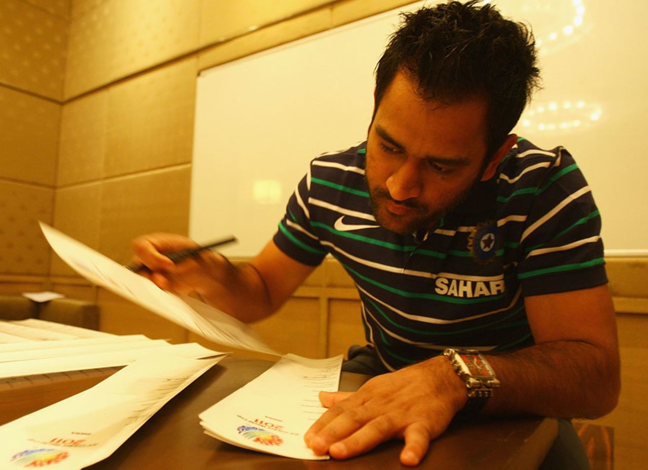 MS Dhoni signs World Cup bat stickers, Bangalore, February 11, 2011