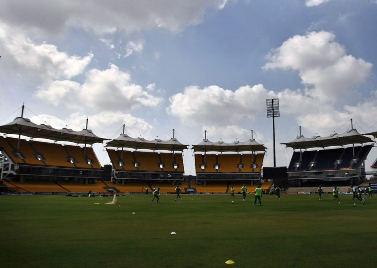 South Africa train against the backdrop of the Chidambaram Stadium's towering stands, Chennai, February 11, 2011