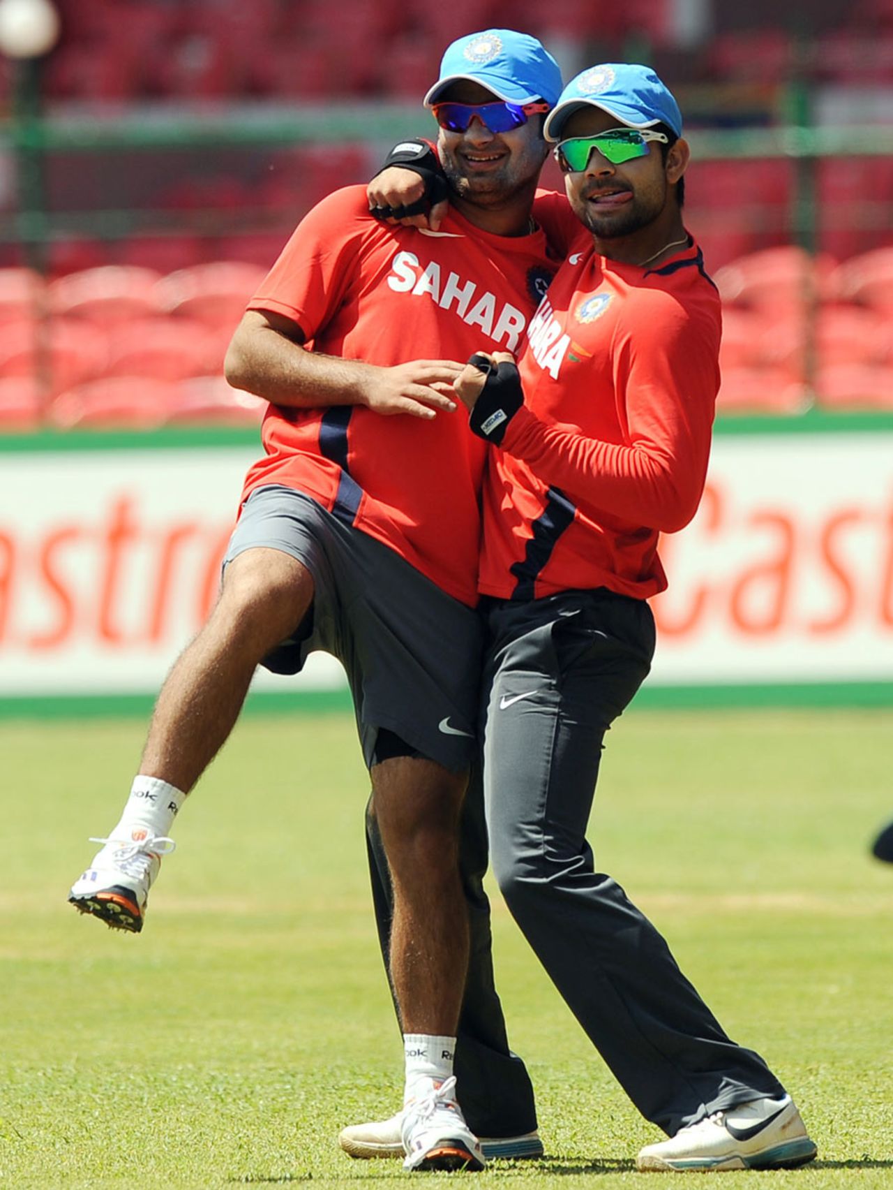 Piyush Chawla and Virat Kohli fool around during a training session, Bangalore, February 12, 2010