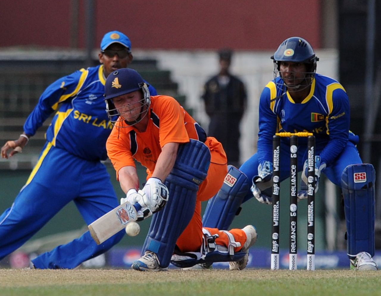 Tom de Grooth attempts a sweep shot during his 76, Sri Lanka v Netherlands World Cup warm-up match, Colombo, February 12, 2011