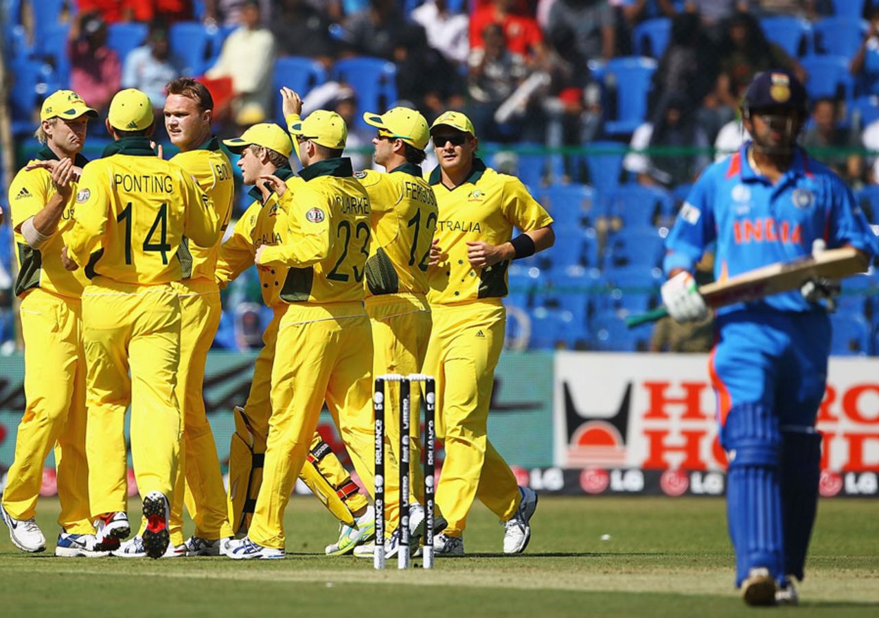 Gautam Gambhir walks back as the Australian fielders celebrate his early dismissal, India v Australia, World Cup warm-up match, Bangalore, February 13, 2011