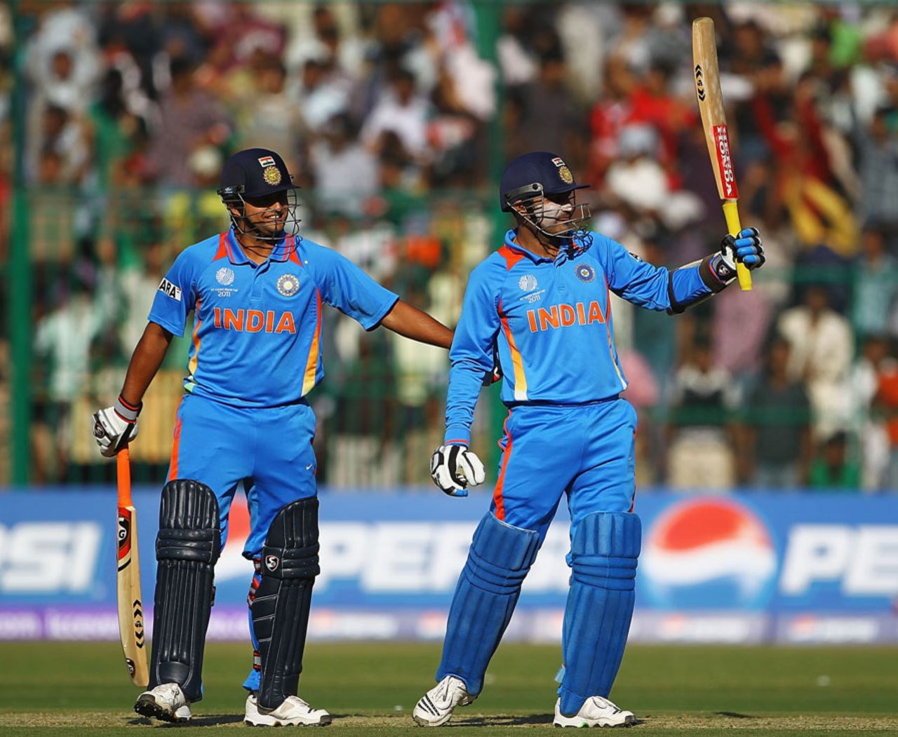 Virender Sehwag celebrates reaching his half-century, India v Australia, World Cup warm-up match, Bangalore, February 13, 2011