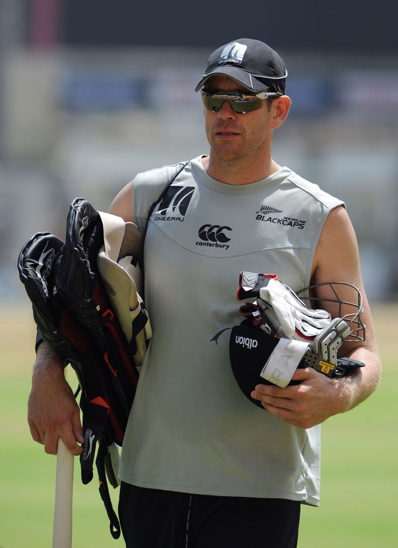 Jacob Oram heads for the batting nets, Chennai, February 14, 2011