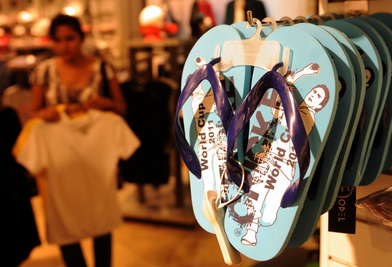 A shopper browses through World Cup souvenir slippers for sale at Odel, a shopping mall, Colombo, February 14, 2011