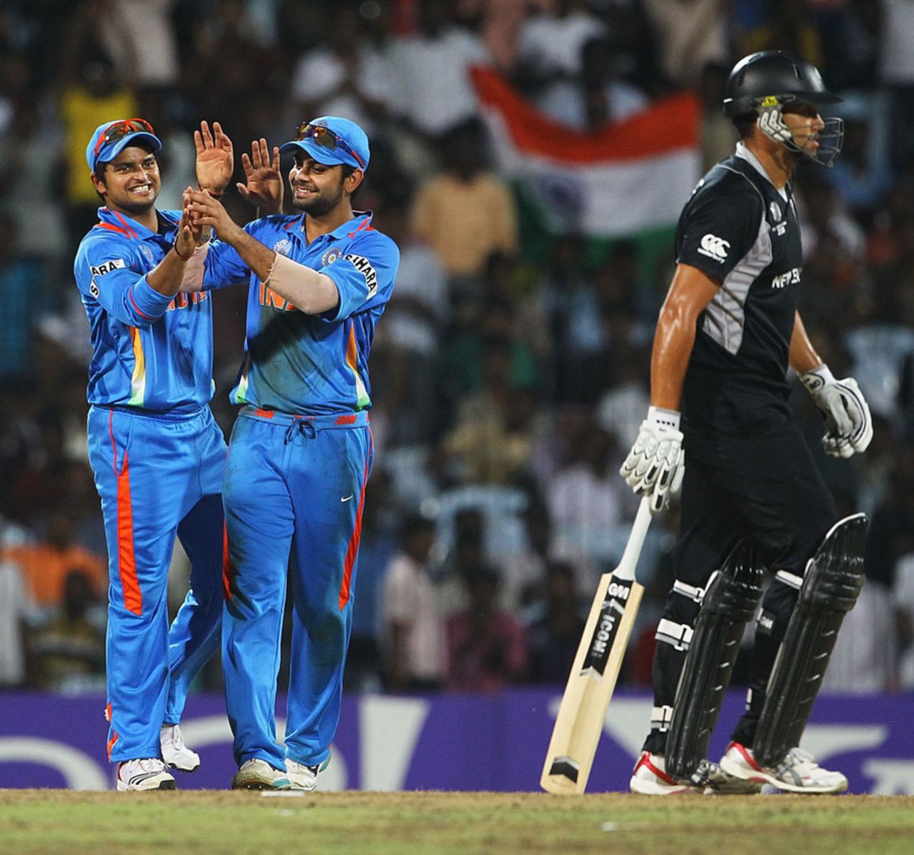 Suresh Raina and Virat Kohli celebrate the wicket of Ross Taylor, India v New Zealand, World Cup 2011 warm-up, Chennai, February 16, 2011