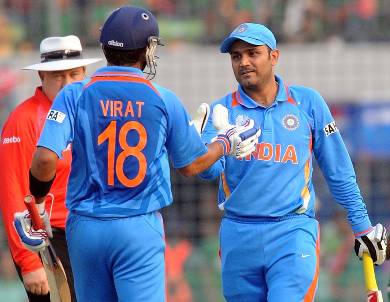 Virender Sehwag is congratulated by Virat Kohli after getting to a century off 94 balls, Bangladesh v India, Group B, World Cup 2011, Mirpur, February 19, 2011