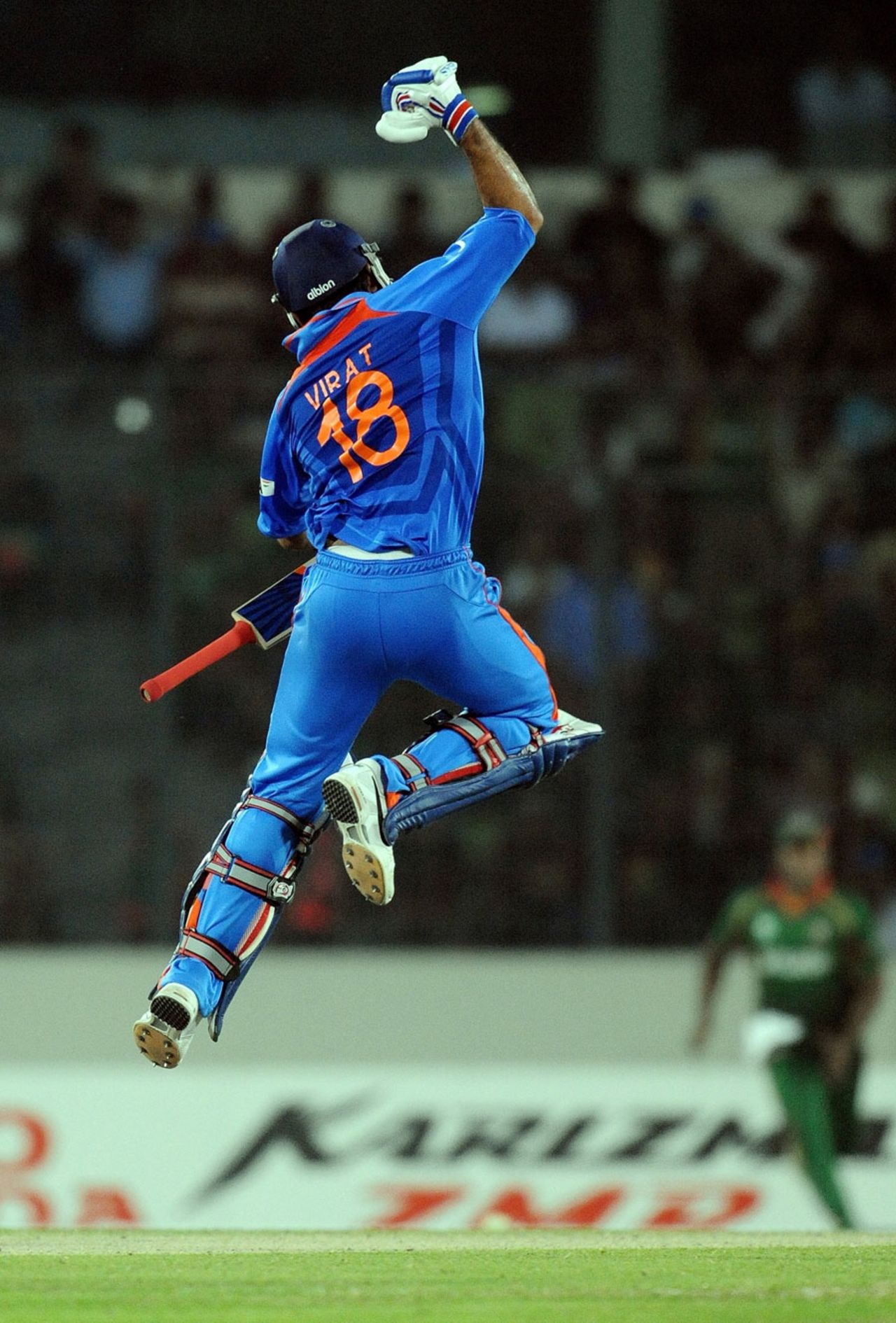 Virat Kohli leaps after getting to a hundred off 83 balls, Bangladesh v India, Group B, World Cup 2011, Mirpur, February 19, 2011