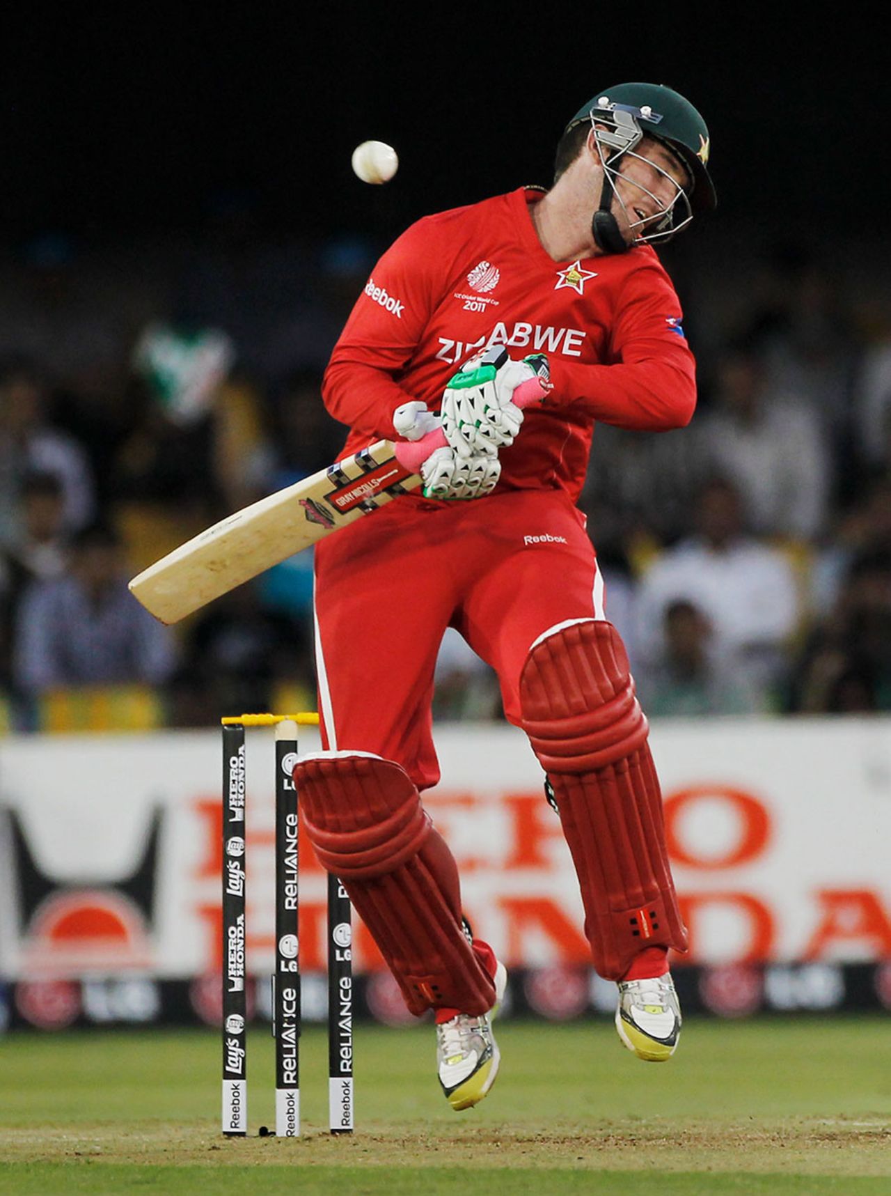 Brendan Taylor sways out of the way of a Shaun Tait bouncer, Australia v Zimbabwe, Group A, World Cup 2011, Ahmedabad, February 21, 2011