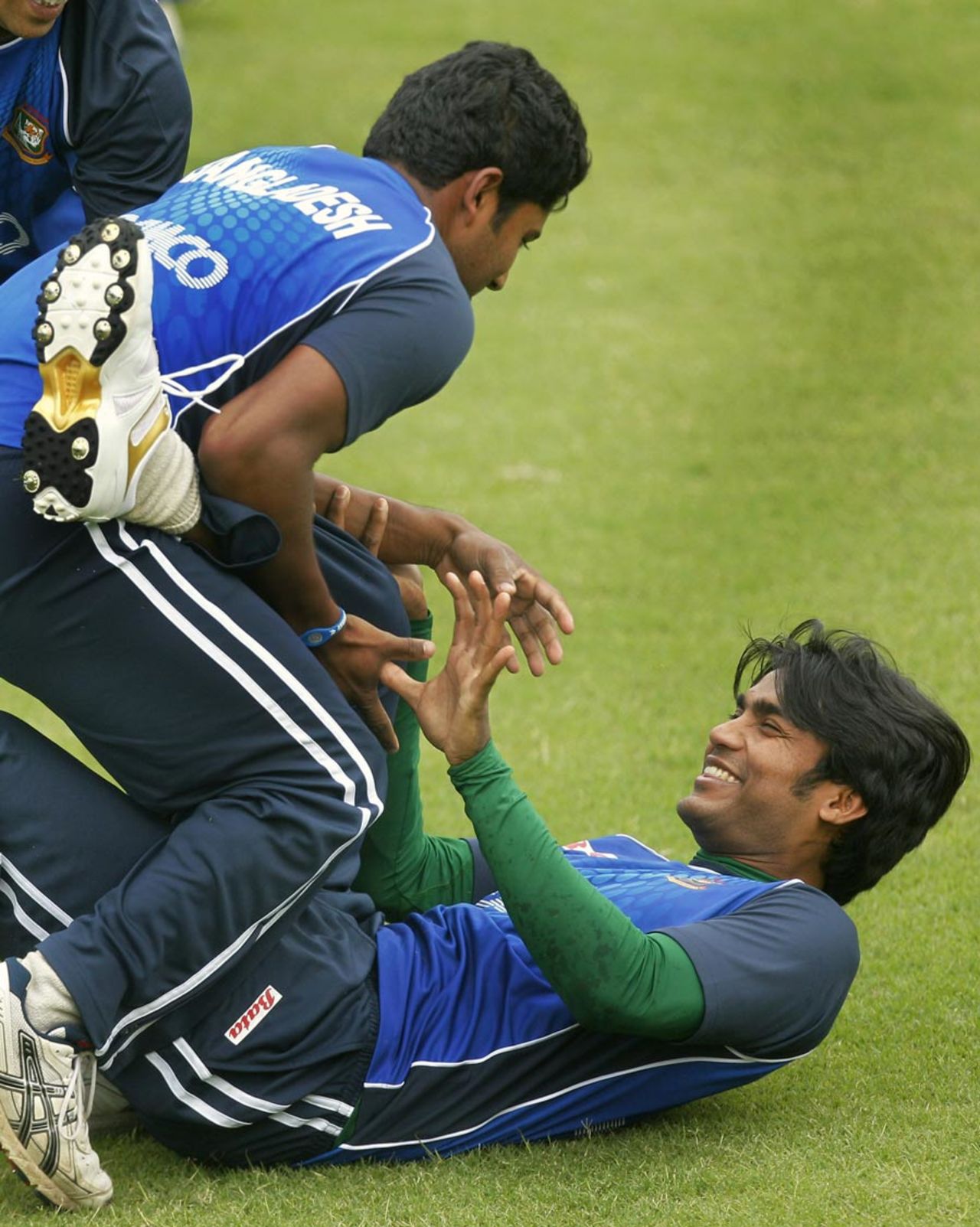 Junaid Siddique has a laugh during the nets, Dhaka, February 21, 2011