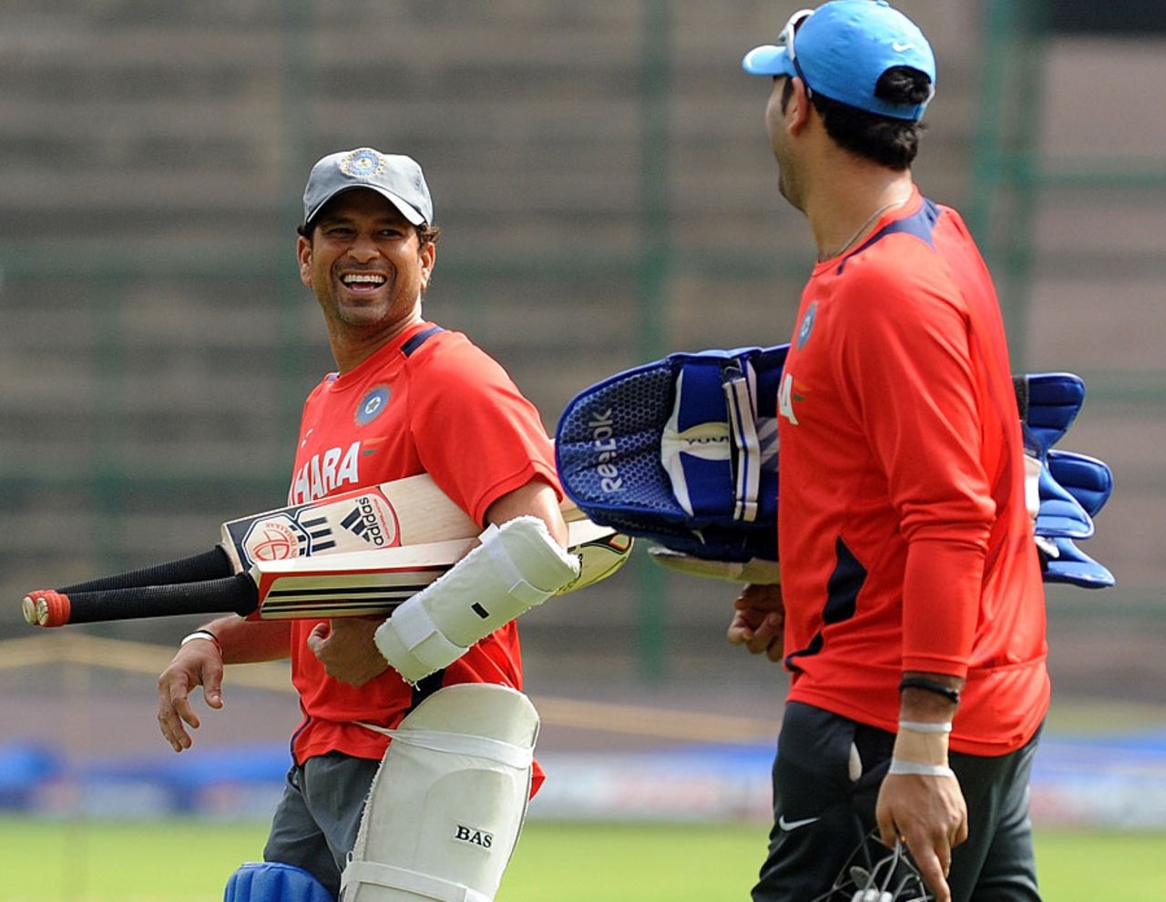 Sachin Tendulkar and Yuvraj Singh share a laugh during India's training session, Bangalore, February 23, 2011
