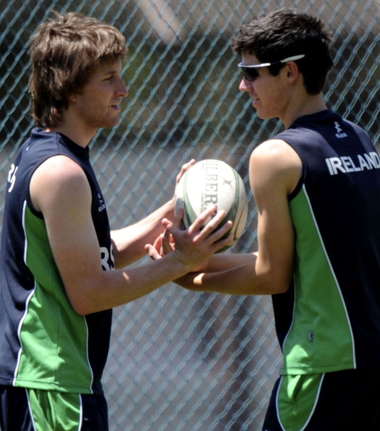 George Dockrell warms up with a rugby ball, Bangalore, February 28, 2011