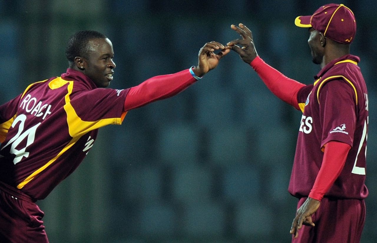 Kemar Roach and Devon Smith celebrate the dismissal of Bas Zuiderent, Netherlands v West Indies, Group B, World Cup 2011, Delhi, February 28, 2011