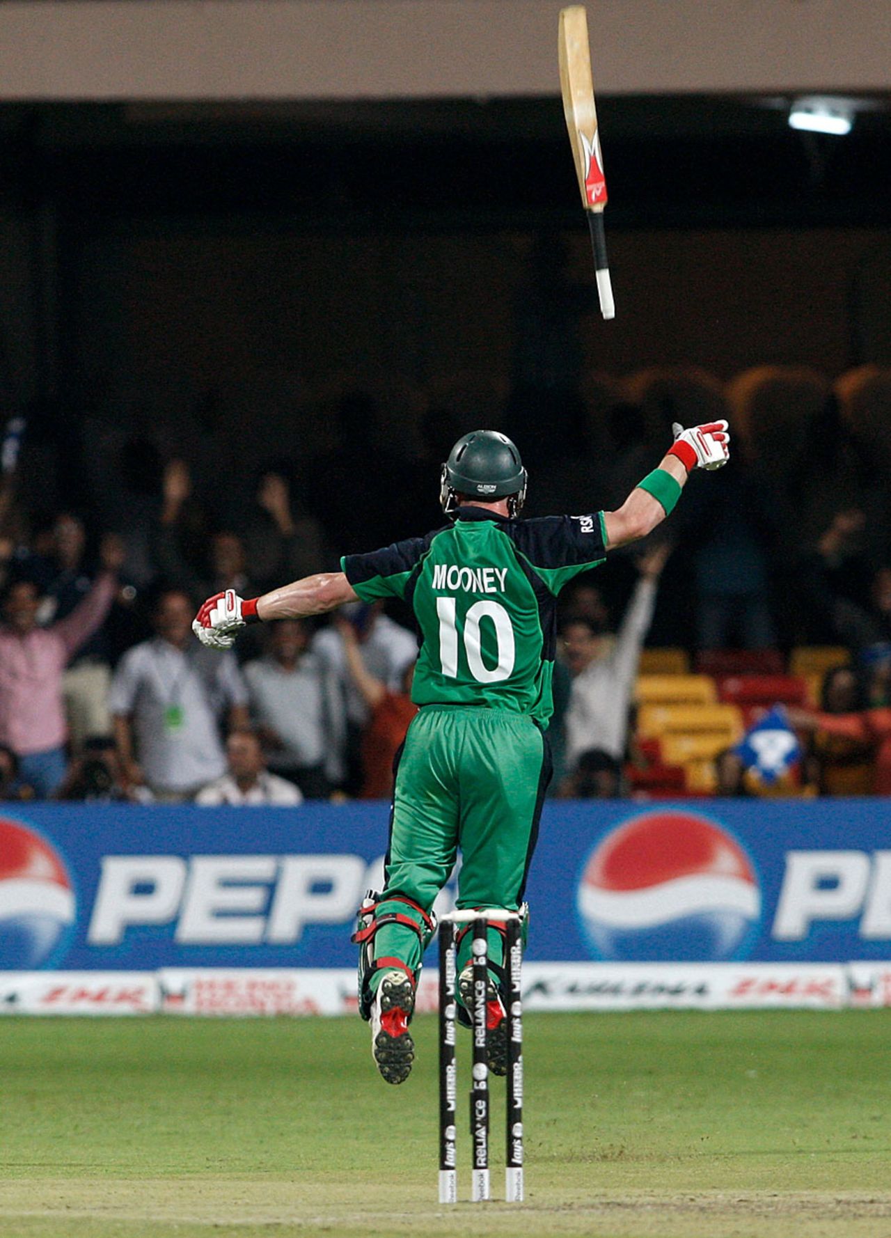 John Mooney flings his bat in the air after securing a dream result with a boundary, England v Ireland, World Cup 2011, Bangalore, March 2, 2011