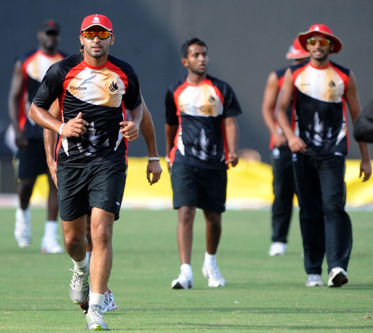 Canada captain Ashish Bagai and his team warm up during a training session, Colombo, March 2, 2011