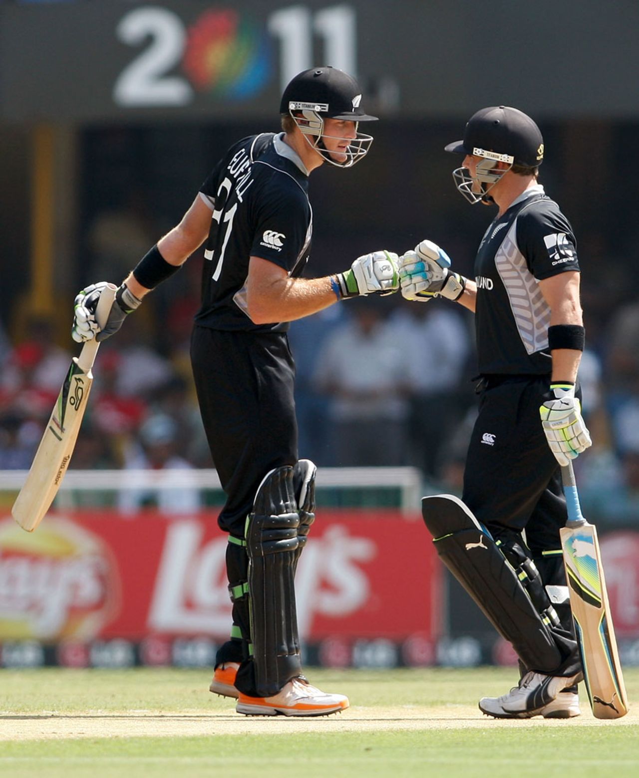 Martin Guptill and Brendon McCullum have a chat during their half-century partnership, New Zealand v Zimbabwe, Group A, World Cup 2011, Motera, March 4, 2011