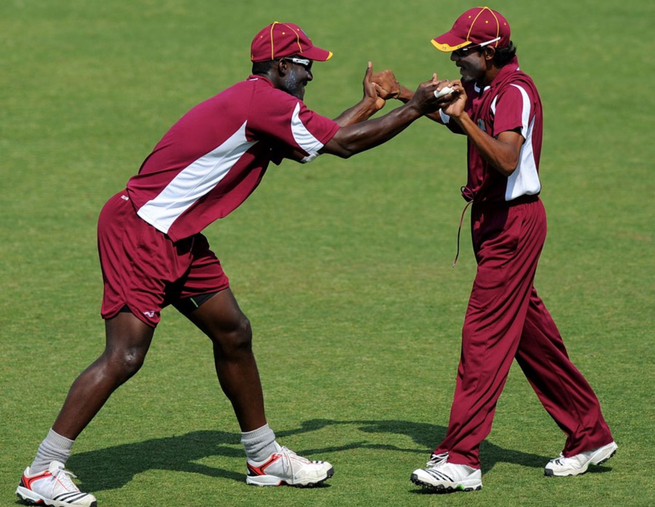 Darren Sammy and Devendra Bishoo have some fun during practice, Mohali, March 11, 2011