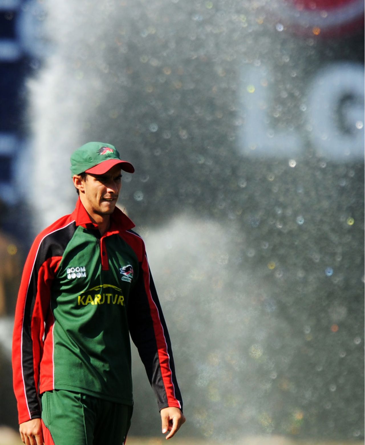 Seren Waters looks on during Kenya's practice session as the outfield is watered, Bangalore, March 12, 2011